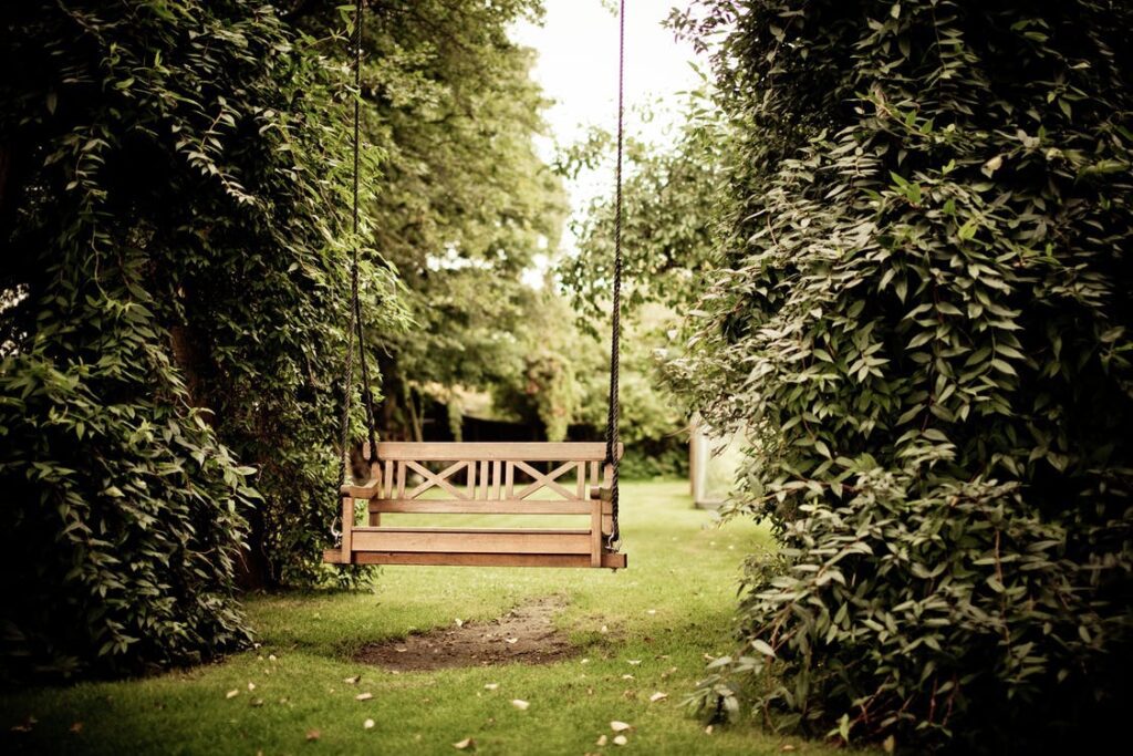 A swing bench in the garden - Fun Garden Ideas
